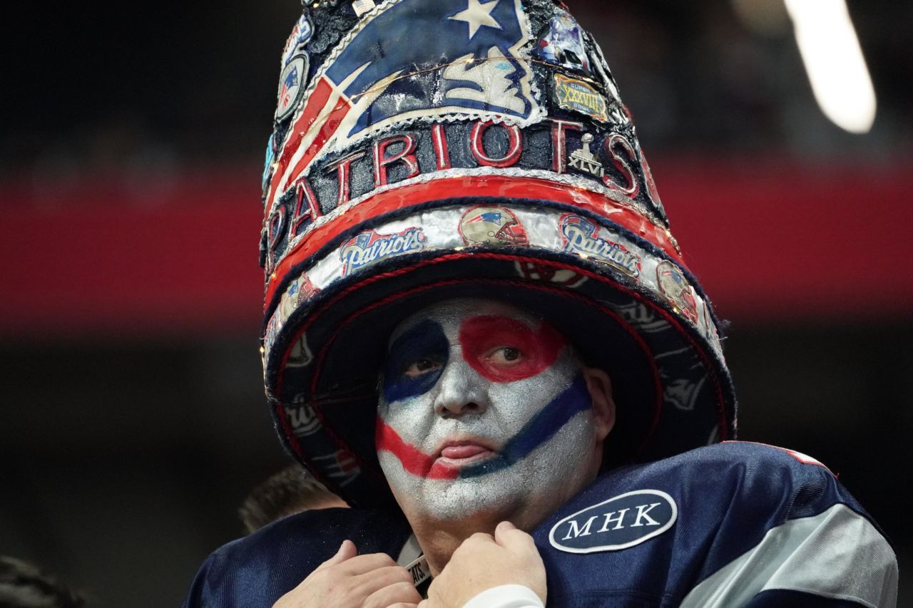 A Patriots fan awaits the start of the game.