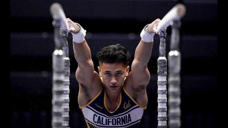 California's Angel Haro performs on the parallel bars during a gymnastics meet against Stanford on Sunday, January 27.