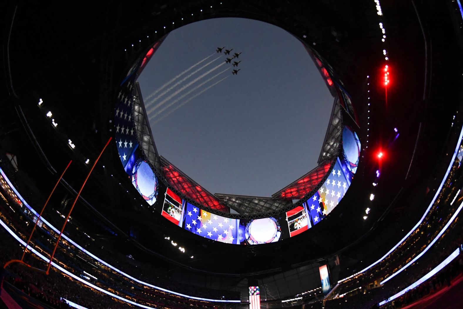 Air Force jets fly over Mercedez-Benz Stadium before the start of the game.