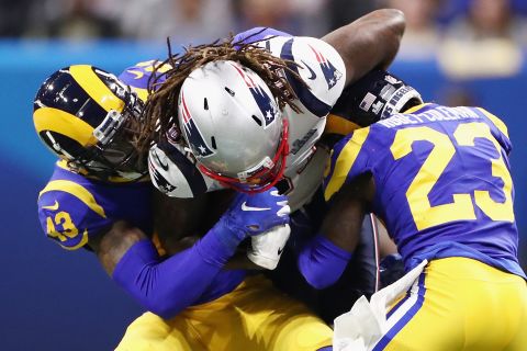 Patriots wide receiver Cordarrelle Patterson is crunched by John Johnson III, left, and Nickell Robey-Coleman in the first quarter.