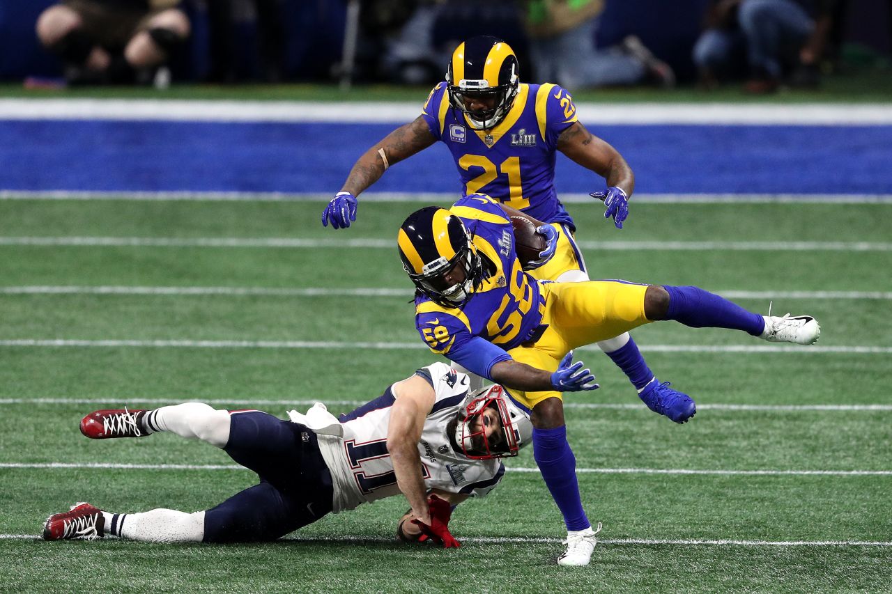 Rams linebacker Cory Littleton intercepts Brady's first pass of the game.