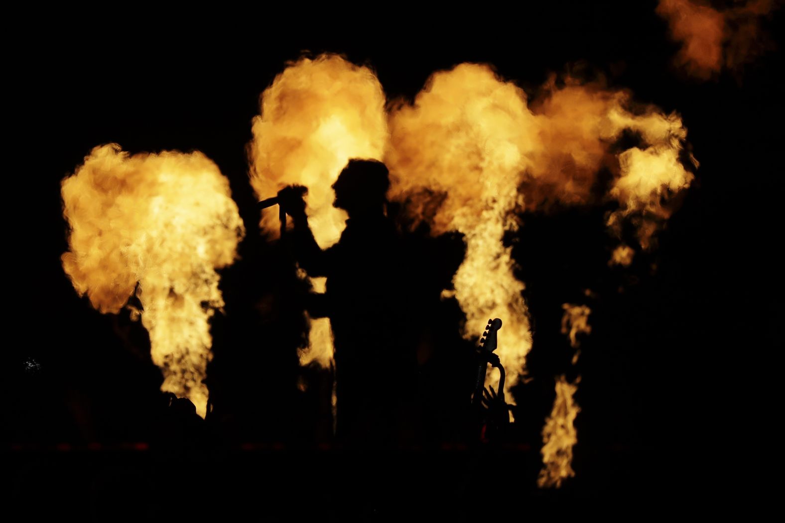 A silhouette of Levine during the show.