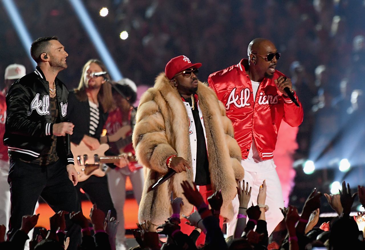 Levine and Big Boi are joined by singer Sleepy Brown, right, during the show.