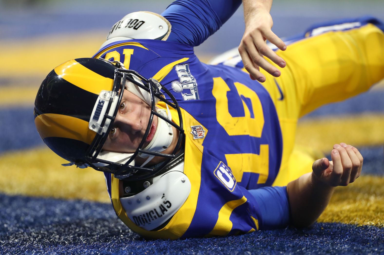 Goff looks up after throwing a pass from his own end zone.