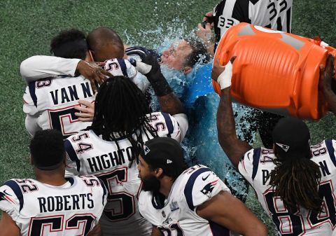 Belichick is doused on the sideline.
