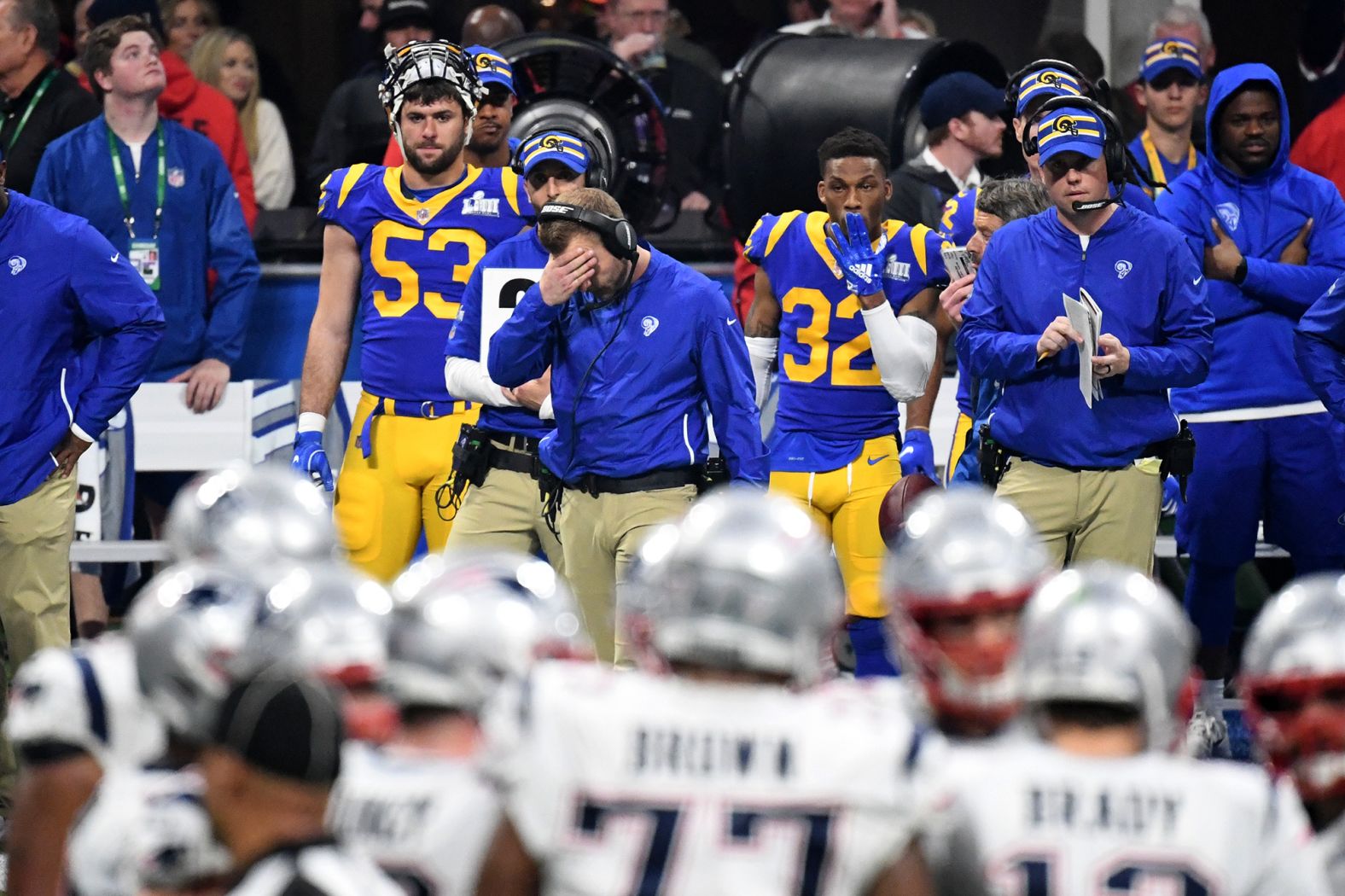 Rams head coach Sean McVay covers his face on the sideline.