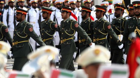 Guards march ahead of the arrival of Pope Francis at the presidential palace.
