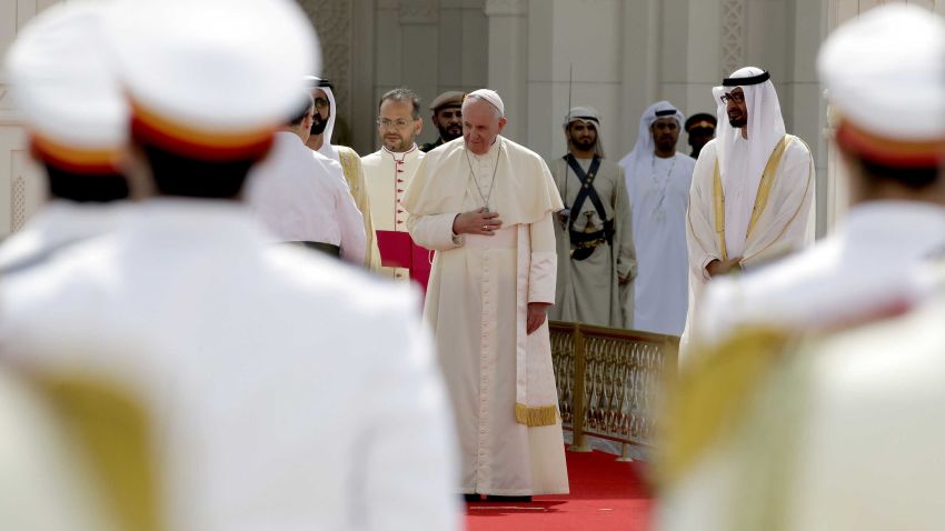 Pope Francis arrives for an official welcome ceremony at the Presidential Palace, in Abu Dhabi, United Arab Emirates, Monday, Feb. 4, 2019. Francis has arrived at the presidential palace to officially start his historic visit to the United Arab Emirates as canons boomed and a military aircraft flew over trailing the yellow and white smoke of the Holy See flag. At right is Crown Prince Sheikh Mohammed bin Zayed Al Nahyan. (AP Photo/Andrew Medichini)