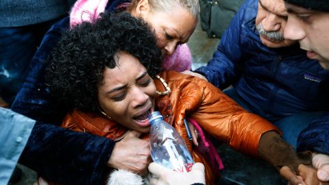 Yandy Smith receives aid after being pepper sprayed at the prison on Sunday.  