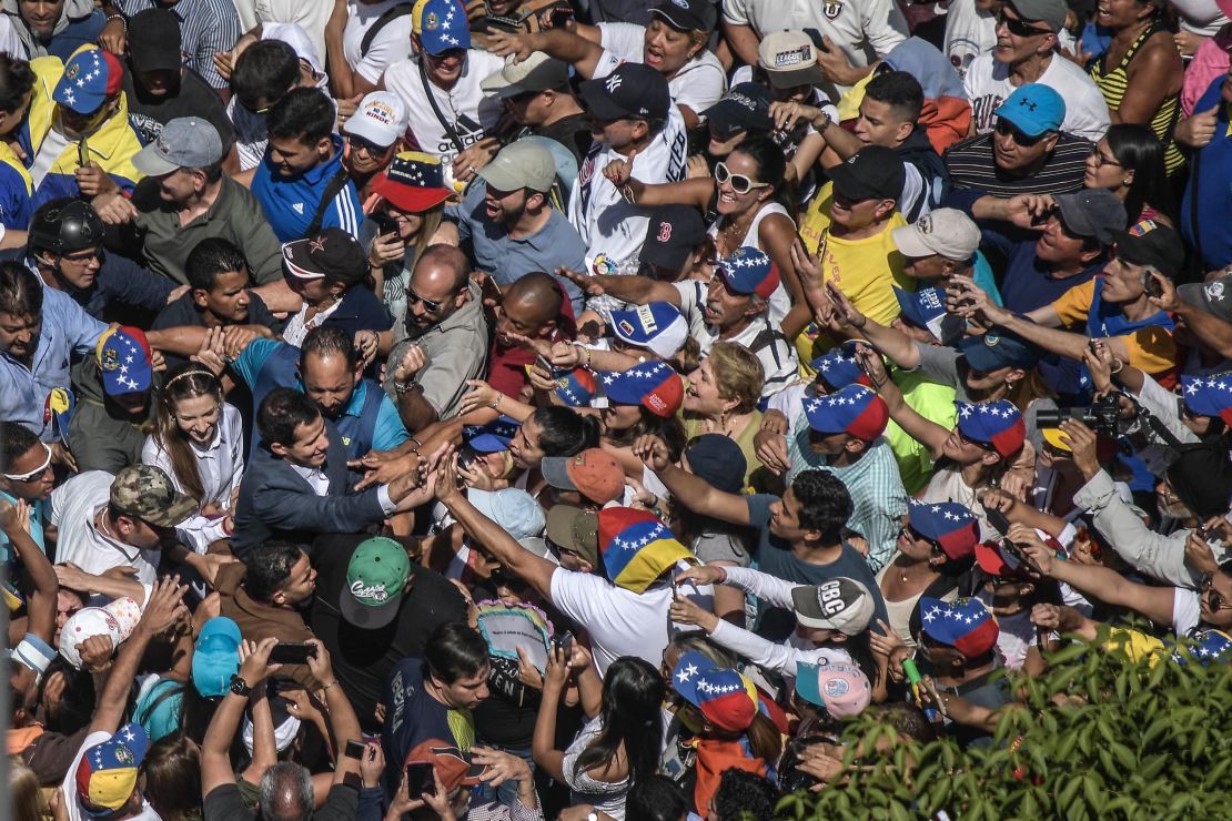 A crowd surrounds Juan Guaido during a protest against Maduro on Saturday.