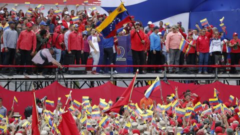 Venezuela's President Nicolas Maduro waves a national flag during a rally in Caracas, Venezuela, Saturday, Feb. 2, 2019.