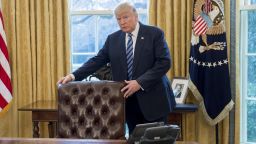 US President Donald Trump stands behind his desk after Jeff Sessions was sworn in as Attorney General in the Oval Office of the White House in Washington, DC, February 9, 2017. / AFP PHOTO / SAUL LOEB        (Photo credit should read SAUL LOEB/AFP/Getty Images)