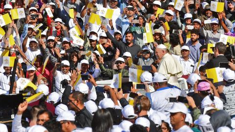 Pope Francis greets crowds as he arrives Tuesday.