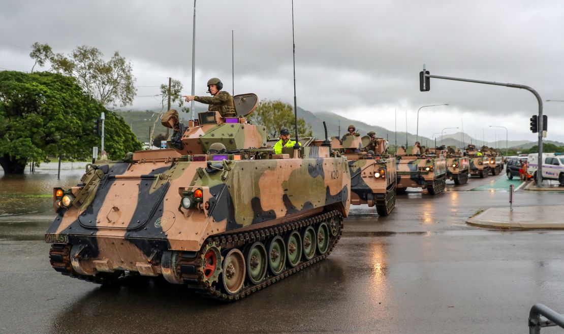 Army vehicles enter Townsville to help evacuate flood-affected people on February 4, 2019.