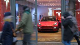 BERLIN, GERMANY - JANUARY 04:  People walk past a Tesla dealership on January 4, 2019 in Berlin, Germany. Tesla is expected to soon begin deliveries of the Model 3 in Europe even though the car has not yet been officially approved by European authorities.  (Photo by Sean Gallup/Getty Images)