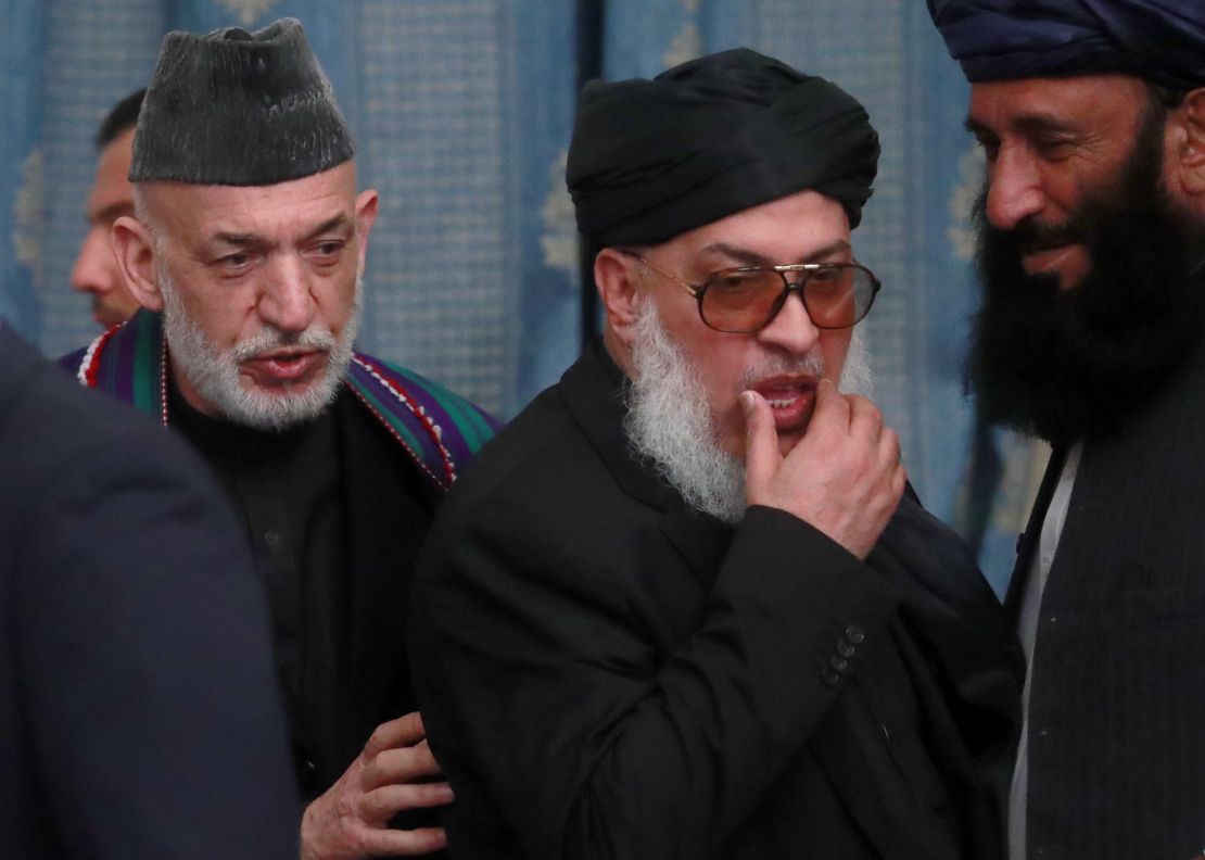 Afghanistan's former president Hamid Karzai (L) and the Taliban's chief delegate Sher Mohammad Abbas Stanikzai at the conference on Afghanistan in Moscow on Tuesday.  