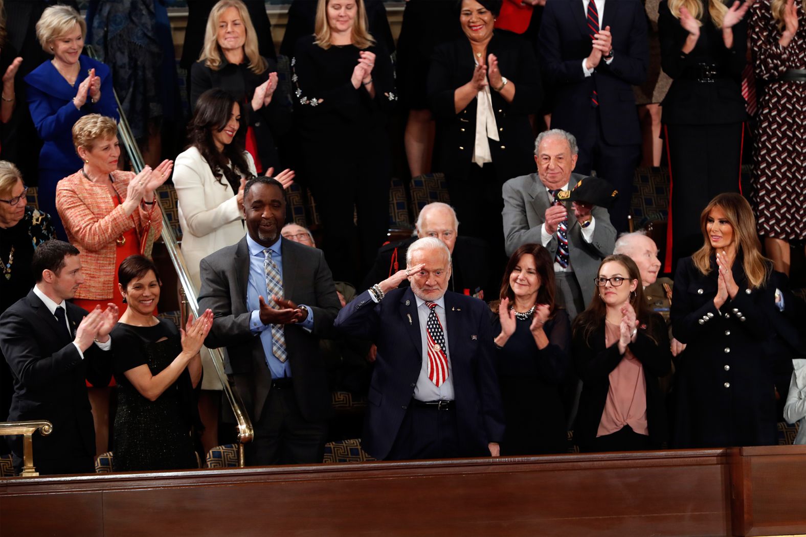 Former NASA astronaut Buzz Aldrin salutes as he is recognized by Trump during his speech. Trump <a href="index.php?page=&url=https%3A%2F%2Fwww.cnn.com%2Fpolitics%2Flive-news%2Fstate-of-the-union-2019%2Fh_e84fe9f712a6fbefa0481f5ba85b5ee4" target="_blank">thanked the Apollo 11 astronaut</a> before saying, "This year, American astronauts will go back to space on American rockets."