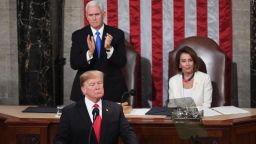 US Vice President Mike Pence (L) stands to applaud as he and Speaker of the US House of Representatives Nancy Pelosi (R) listen to US President Donald Trump deliver the State of the Union address at the US Capitol in Washington, DC, on February 5, 2019. (Photo by SAUL LOEB / AFP)        (Photo credit should read SAUL LOEB/AFP/Getty Images)