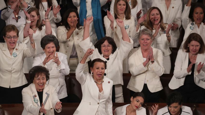 WASHINGTON, DC - FEBRUARY 05:  Female lawmakers cheer during President Donald Trump's State of the Union address in the chamber of the U.S. House of Representatives at the U.S. Capitol Building on February 5, 2019 in Washington, DC. A group of female Democratic lawmakers chose to wear white to the speech in solidarity with women and a nod to the suffragette movement.  (Photo by Alex Wong/Getty Images)