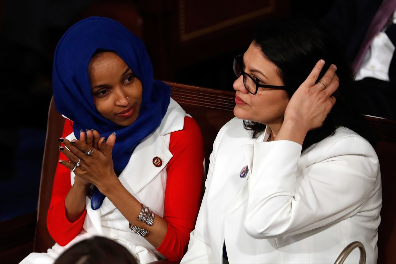 The first two Muslim women to serve in Congress — US Reps. Ilhan Omar, left, and Rashida Tlaib — listen to Trump's speech.