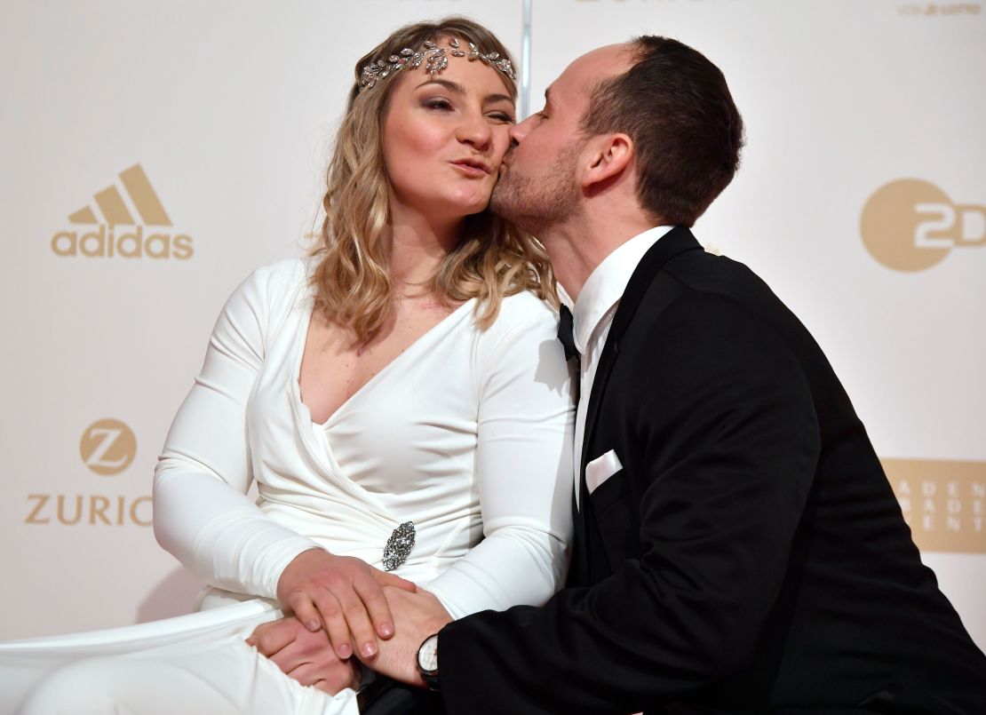 Vogel (L) and her partner German track cyclist Michael Seidenbecher pose upon arrival for the awards ceremony for "Germany's Sportsperson Athlete of the Year 2018" in Baden-Baden.