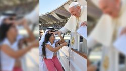 Pope Francis blesses a child before celebrating a mass at Zayed Sports City Stadium in Abu Dhabi, United Arab Emirates, February 5, 2019. Vatican Media/Handout via REUTERS  ATTENTION EDITORS - THIS IMAGE WAS PROVIDED BY A THIRD PARTY.
