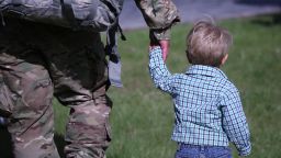 FORT DRUM, NY - MAY 17:  A father and son walk from a welcome-home ceremony for soldiers returning from Iraq on May 17, 2016 at Fort Drum, New York. More than 1,000 members of the 10th Mountain Division 1st Brigade Combat Team are returning home after a 9-month deployment in Iraq as part of Operation Inherent Resolve to train and advise Iraqi forces fighting the Islamic State. The 10th Mountain brigade was replaced in Iraq by the 101st Airborne 2nd Brigade Combat Team based at Ft. Campbell, Kentucky.  (Photo by John Moore/Getty Images)