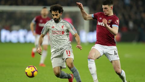Mohamed Salah of Liverpool battles for possession with Declan Rice of West Ham United in February.