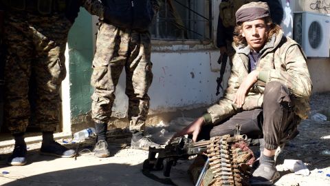 Arab fighters from the Shuaitat tribe take positions around ISIS's last stronghold in eastern Syria.