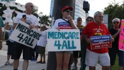 FORT LAUDERDALE, FL - JULY 24: PJ Espinal (C) joins with other protesters against Republican senators who have not spoken up against Affordable Care Act repeal and demand universal, affordable, quality healthcare for all on July 24, 2017 in Fort Lauderdale, United States. The U.S. Senate is expected to vote tomorrow on the health care legislation after they twice postponed the vote.  (Photo by Joe Raedle/Getty Images)