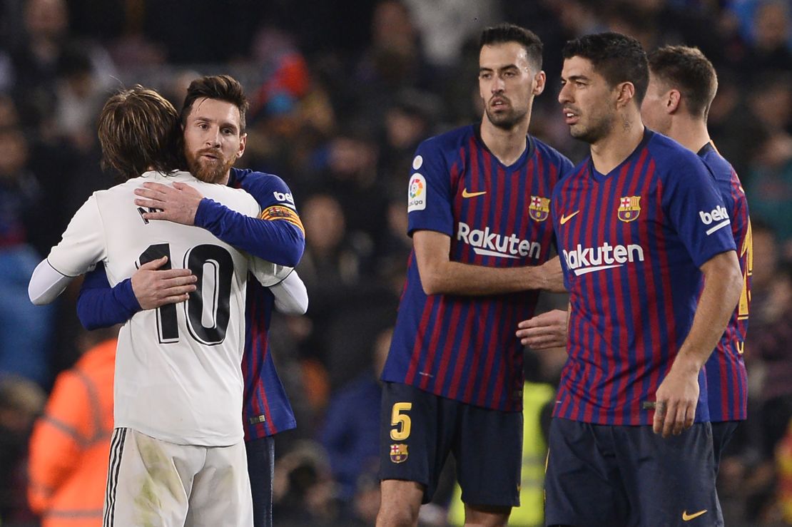 Lionel Messi and Luka Modric embrace after full time.