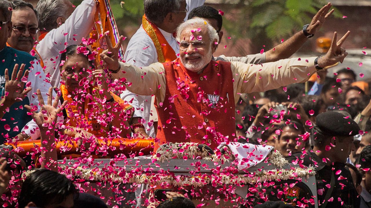 Narendra Modi is covered in flower petals while campaigning in Vadodra, India this week.  