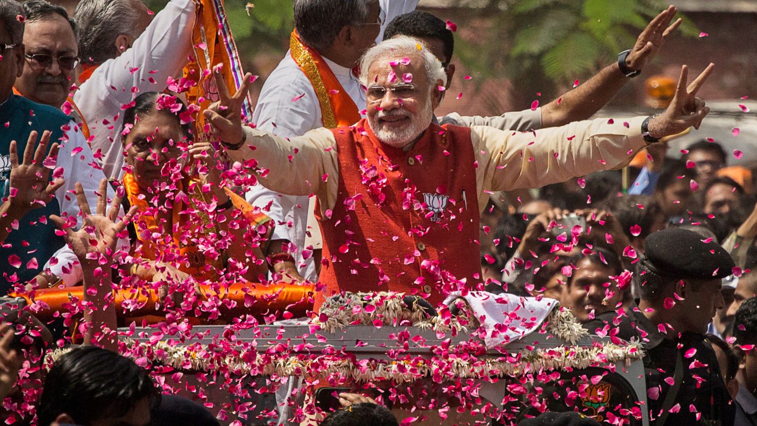Narendra Modi is covered in flower petals while campaigning in Vadodra, India this week.  