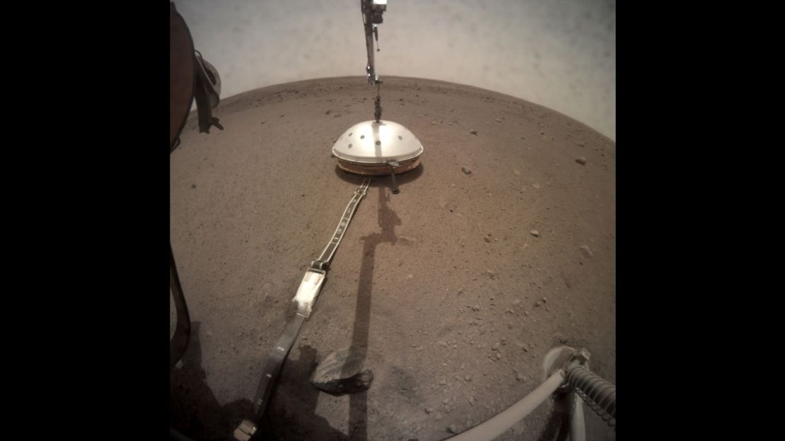 NASA's InSight lander deployed its Wind and Thermal Shield to cover InSight's seismometer.