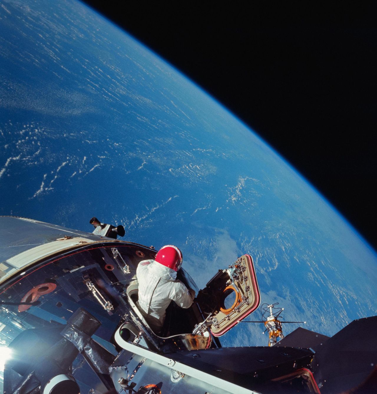 Astronaut Dave Scott looks at planet Earth from the hatch of Apollo 9 in March 1969.