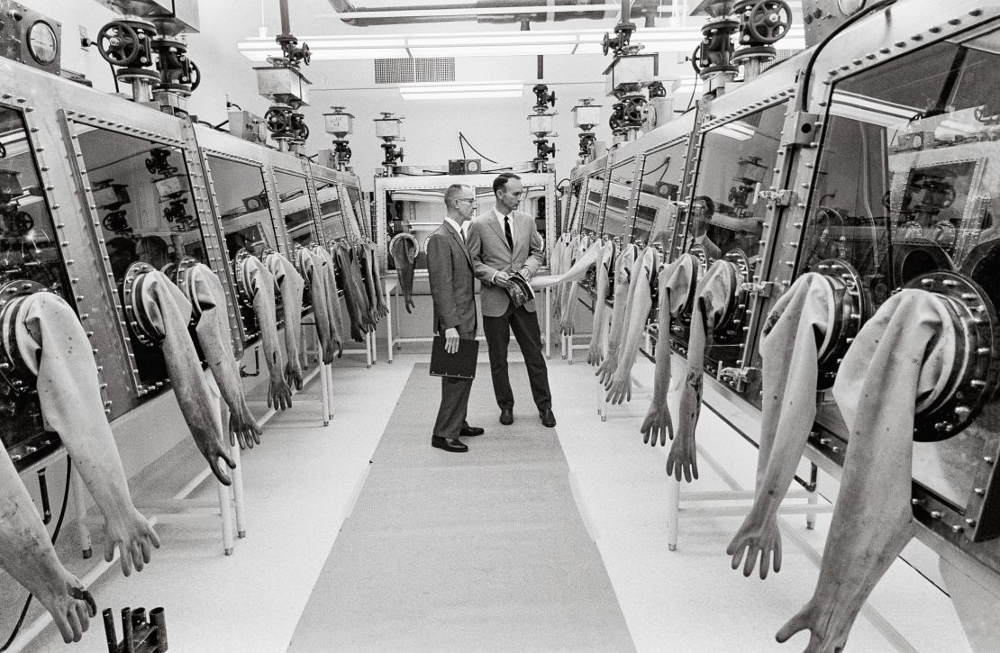 Apollo 11 Command Module Pilot Michael Collins inspects NASA's Lunar Receiving Laboratory at the Manned Spacecraft Center in Houston.  