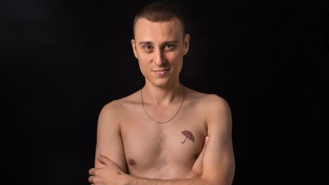 Thierry Shaffauser, 36, displays his red umbrella tattoo, a symbol for sex workers' rights.