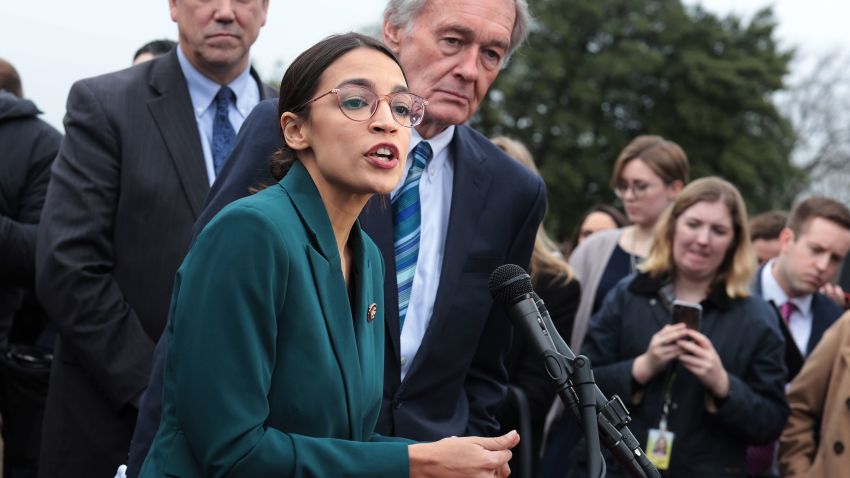 WASHINGTON, DC - FEBRUARY 07:  U.S. Rep. Alexandria Ocasio-Cortez (D-NY) speaks as Sen. Ed Markey (D-MA) (R) listens during a news conference in front of the U.S. Capitol February 7, 2019 in Washington, DC. Sen. Markey and Rep. Ocasio-Cortez held a news conference to unveil their Green New Deal resolution.