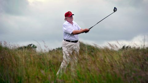 US tycoon Donald Trump plays a stroke as he officially opens his new multi-million pound Trump International Golf Links course in Aberdeenshire, Scotland, on July 10, 2012. Work on the course began in July 2010, four years after the plans were originally submitted. AFP PHOTO / Andy Buchanan (Photo credit should read Andy Buchanan/AFP/GettyImages)