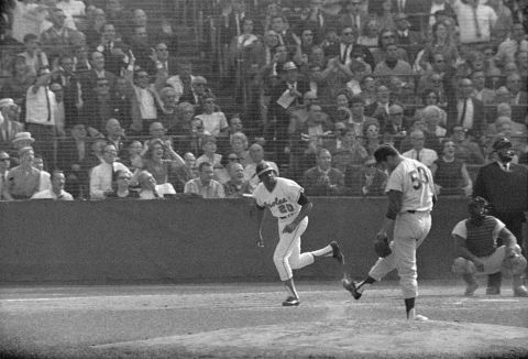 Los Angeles Dodgers pitcher Don Drysdale kicks dirt on the mound after Robinson hit a home run against him during the 1966 World Series.