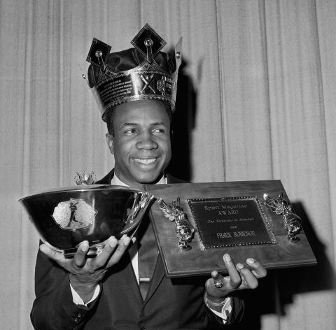 Robinson shows off some of his individual awards from the 1966 season.