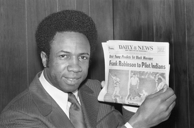 Robinson shows a newspaper predicting that he would become the first black manager in Major League Baseball history.