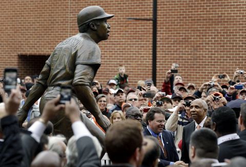 Robinson looks at a statue of him that the Orioles unveiled in 2012.