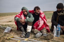 Two young men waiting for interrogation.