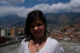 Rosbelis, 12, wants to escape the hunger and violence of Petare and become a photographer. 