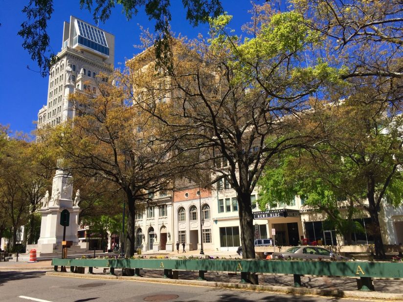 <strong>City promenade:</strong> I had a family member take over bedside duties on a warm, sunny afternoon on March 31, 2018. I took full advantage of the respite and headed to Broad Street, the main commercial street running through downtown Augusta, Georgia, for a long walk. At left is the Lamar Building, completed in 1918. It was topped by a contemporary penthouse designed by I. M. Pei in 1975. 