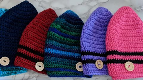 Kurt Stapleton crochets hats to help keep the heads of cancer patients warm.