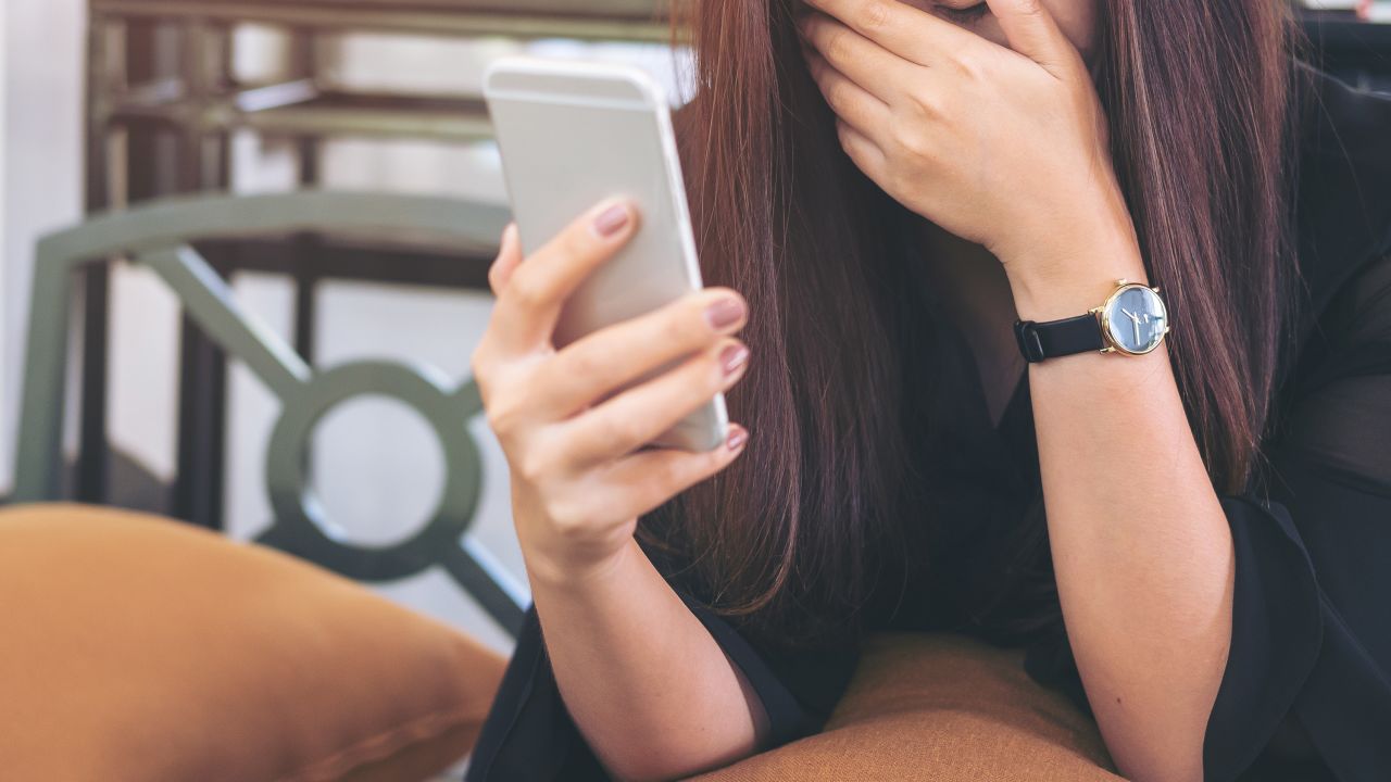 02 woman phone shocked