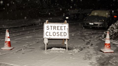 A sign blocks drivers from using an unsafe road in Seattle.