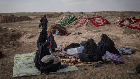 In the desert outside Baghouz Al-Fawqani, civilians are screened by the SDF.